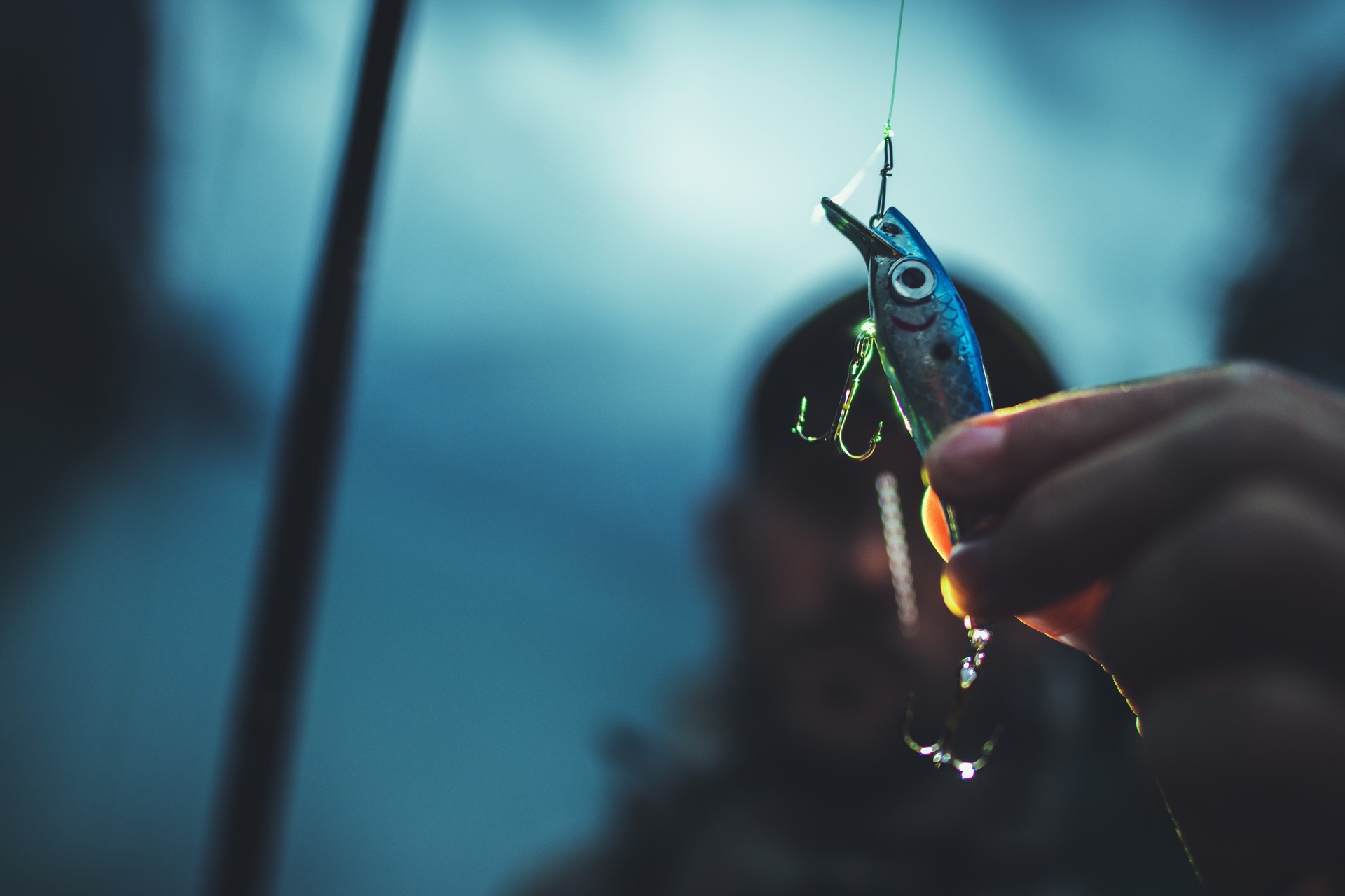Man-holding-a-fishing-lure
